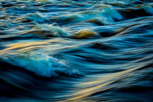 Flowing river water over rocks